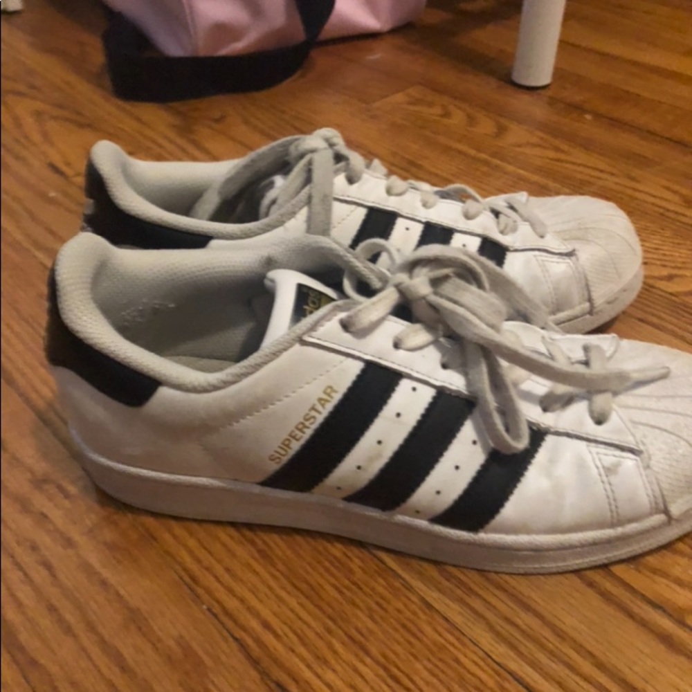 Black and white superstar adidas sneakers